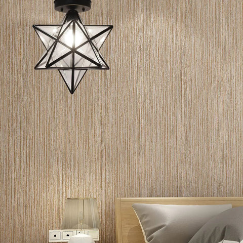 Moravian Star Tiffany Style Clear Glass Ceiling Light With Matte Black Base 12 Inch Shade in modern bedroom setting.
