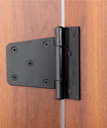 Heavy Duty Black Iron Hinges For Outdoor Barn Shed And Fence Gate Wood Doors 4.5 Inch secured on wood door with screws.