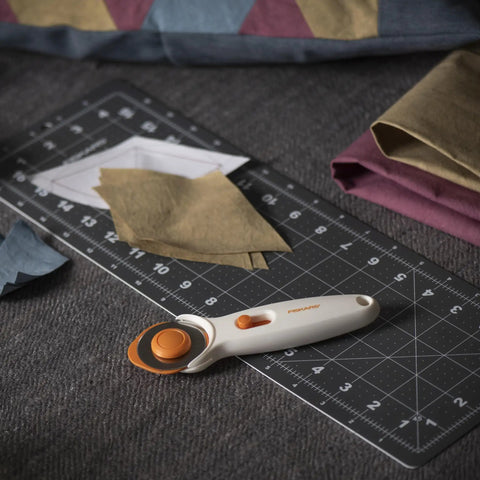 45mm Rotary Cutter For Fabric, Cuts Through Multiple Layers, Left Or Right Handed, Easy Safe Blade Change on cutting mat