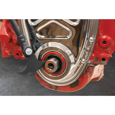 Indexing Twin Hook Oil And Grease Seal Puller with 14 Locking Positions and 195 Degree Reach in use on metal housing