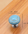 Totally Groovy Blue Mushroom Ceramic Cabinet Knobs, 6 Pack, 1.38 Inch Diameter on wood surface with measurements.