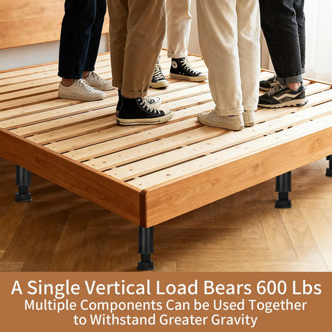 Kick Up Your Setup With These Swappable Heavy Duty Adjustable Metal Furniture Legs An Eight Piece Kit Lifting Beds Couches Cabinets And Dressers Four Point Seven To Eight Two Inches High, demonstrating load capacity with multiple people standing.