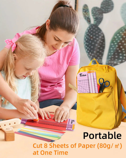 Child using Pink A5 Paper Cutter Guillotine with Side Ruler for scrapbooking, supervised by adult, bright yellow backpack nearby.
