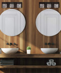 Bathroom with wood paneling, round mirrors, and a brushed nickel one light outdoor wall lantern with bubble glass cube