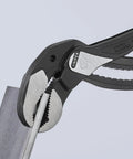 Alligator Water Pump Pliers XL 16 Inch Beefy Grip Self Locking for Pipes and Nuts gripping a metal pipe