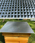 Close-up of bead-structured Five Pack Thickened Aluminum Reflective Insulation Film For Beehives on a wooden hive.
