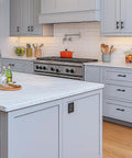 Modern kitchen with 3 Inch Black Cabinet Handles 30 Pack Square Zinc Alloy Pulls visible on light gray cabinets