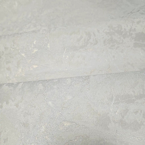 Ivory And Off White Rose Gold Cracked Faux Concrete Plaster Textured Wallpaper Rolls close-up view of cracked plaster texture