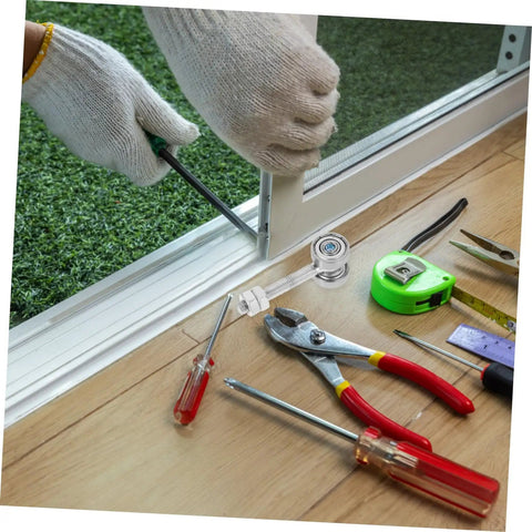 Installing Heavy Duty Sliding Door Wheel Roller Kit With Double Bearing Steel Trolley Carriage using tools on a floor.