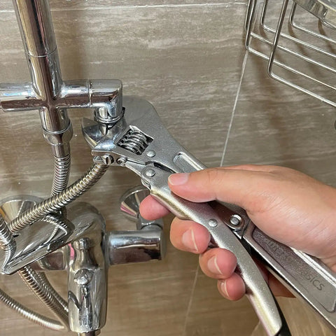10 Inch Locking Adjustable Wrench With Quick Release And Inch Metric Scale Rust Resistant Precision Machined Jaw And Worm Gear Drop Forged Carbon Steel For Auto Repair Plumbing And DIY Maintenance 2.7 X 0.75 Inch in use tightening a faucet connection