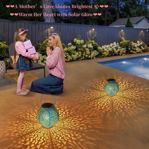2 Pack Solar Lanterns Outdoor Lights Waterproof Garden Patio Decor Auto On At Dusk For 6 Hours Warm White 7 Lumens Cozy Yard Vibe Perfect Gift For Mom Wife Grandma On Mothers Day illuminating patio with mom and child