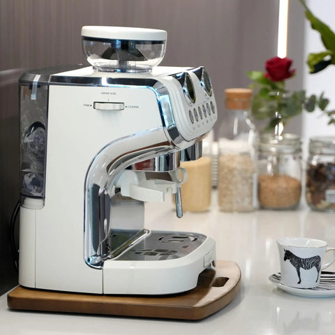 Rock Solid Wooden Appliance Slider With 360 Rolling Wheels For Coffee Makers with a coffee machine on it in a kitchen setting.