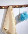 Rock Solid Wall Mounted Coat Rack With Five Hooks For Entryway And Bathroom No Fuss Flush Mount Design Effortless Diy Install showing towel and loofah.
