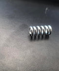 Close-up of a metal spring for Durable Plastic Air Compressor Regulator Knob 1370001 Replacement For Sanborn Craftsman Coleman PowerMate