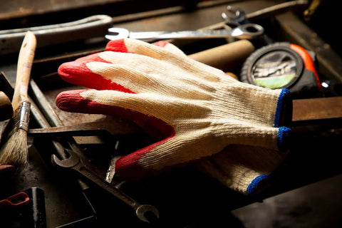 Economical String Knit Latex Dipped Palm Gloves With Nitrile Coated Fingers For General Purpose Work on a workbench