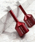 Two red ONEGOTOOL diamond hole saw bits, 1/4 in (6mm), for porcelain and ceramic tile, shown on marble surface.