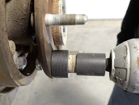 Wheel Stud Installer Tool For Cars And Light Trucks Quick Lug Nut Style Stud Puller in use with impact wrench on wheel hub