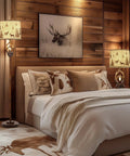 Rustic Farmhouse Antlers Floor Lamp With Nightlight, 63.5 Inch Tall Brown Finish next to a cozy bed in a wooden bedroom.