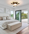 4 Light Industrial Ceiling Light In Matte Black With Open Frame Cage Design installed in a modern bedroom setting