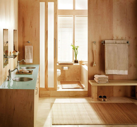 Spa-like bathroom with natural wood elements and beige towels, highlighting a Retreat Brushed Nickel Double Post Pivoting Wall Mounted Toilet Paper Holder.