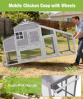 Man moving Mobile Chicken Coop With Run For Secure Poultry Housing On Wheels Nesting Box And Slide Out Tray Waterproof Roof