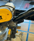Image of a Two And A Half Inch Hose Adapter For Miter Saws Quick Hookup And Easy Dust Collection Connection Fits Models DWS713 DWS715 DW716 DWS716 DWS779 DWS780 DCS781B DHS790 Made In USA installed on a DeWalt miter saw.