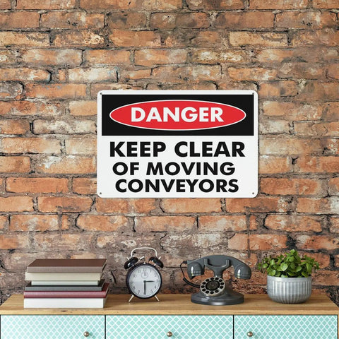 Danger Maintain Clearance Around Moving Conveyors Caution Sign 8 By 12 Inches on brick wall above wooden shelf.