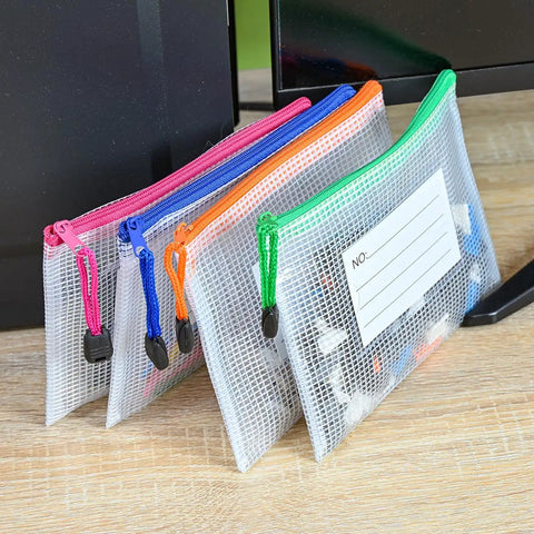 12 Pack Mesh Zipper Pouches With Label Pockets For Office Home And Travel Waterproof A6 Size File Bags on a desk