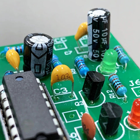 Close-up of PCB with Starter Pack Ceramic Capacitor Kit With 30 Values And 600 Pieces For DIY Electronics components