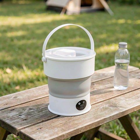 Compact Folding Mini Washing Machine Portable Laundry Basin on wooden table outdoors, ideal for road trips and dorms.