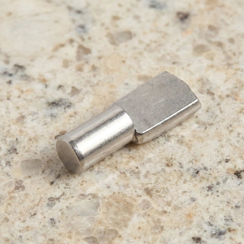 Stainless Steel Shelf Pins 5mm Nickel Finish Pack Of 150 for stable support in home cabinets, close-up view on stone surface