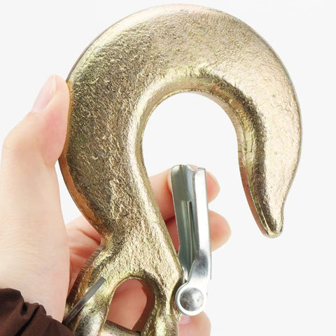 Close-up of a hand holding a 2 Pack 1/2 Inch G70 Forged Steel Clevis Grab Hook With Safety Latch, zinc plated.