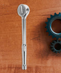 Heavy Duty 3/8 Inch Drive Ratchet Socket Wrench With Smooth Reversible Action And Quick Release Handle on wooden background.
