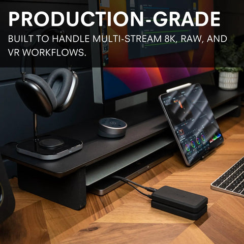 Beast 2TB External NVMe SSD With Thunderbolt 3 Ultra Fast 2800 MBs Read 2600 MBs Write For 4K 8K Editing VR And Big Media Backups Fanless Rugged Aluminum Enclosure Meets MIL STD 810F on desk with laptop