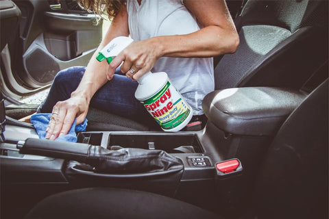 Person cleaning car interior with Heavy Duty Cleaner Degreaser And Disinfectant All In One For Kitchens Bathrooms Tools Engines Vinyl Stainless Steel