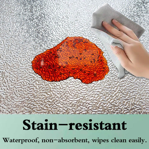 Heavy Duty Fireproof Heat Shield Board in action with spill, easily wiped clean, demonstrating oilproof surface for kitchen protection.