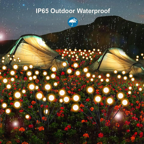 Bright Solar Outdoor Garden Spotlights Eight Head LED Landscape Lights illuminating a garden at night, IP65 Waterproof