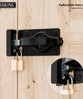Heavy Duty Swinging Barn Door Latch With Dual Sided Handle for Inside and Outside Access on gates, shown with padlock.