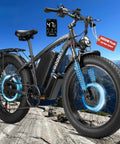 Blue Beast 9000W Peak Dual Motor Ebike For Adults With 24 Inch Fat Tires on rocky mountain terrain.