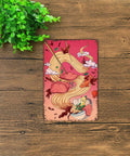 Vintage Metal Sign Ramen Bowl Cat And Goldfish Tin Wall Art 8 By 12 Inch showing a playful cat and goldfish in a ramen bowl on a table.