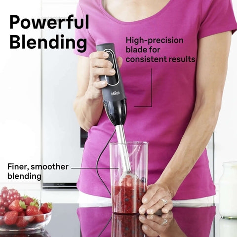 Game Changer 350 Watt Hand Blender With Beaker And Whisk Attachment providing dual speed control, blending berries in a clear beaker.