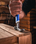 Person using 10 Inch Nail Puller Cats Paw Pry Bar With Magnetic Hammer Head Crowbar for nail removal on wooden board
