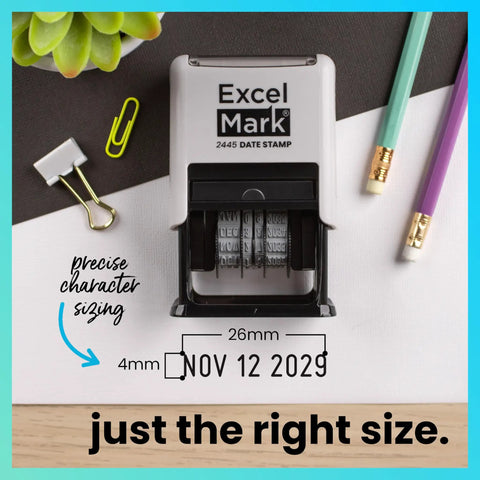 Straight Up Knockout Date Stamp For Shipping And Receiving Orders Track Expiration And Due Dates Smooth Gliding Mechanism Crisp Black Ink On Durable Gray Mount on a desk with office supplies.