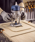 Person using No Sweat Router Table Insert Plate Template Kit With Solid Density Board Quickset Threaded Inserts And Razor Sharp Flush Trim Blade.