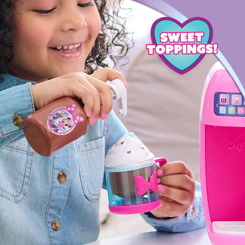 Child playing with Minnie Mouse Bowrista 10 Inch Kids Espresso Machine Play Set With Cups Syrup Bottle Frothing Pitcher and Toppings