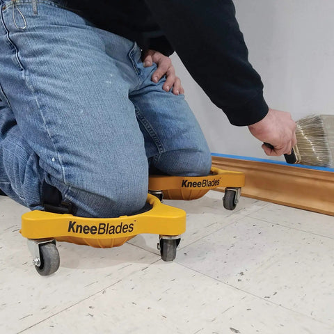 Person using Heavy Duty Knee Blades With Gel Cushions And Three Casters For Unisex Adults, painting with ease on floor