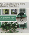 Old School Vintage S Style Cast Iron Window Shutter Dogs With Rust Resistant Powder Coat for outdoor use shown on green shutters.