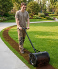Man using Beefy Compost Spreader For Lawn Care And Garden, 16.5 Inch Wide Peat Moss Spreader With T Shaped Handle on grass