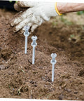 Installing Ten Piece Lawn Aerator Shoes With Metal Spikes For Deep Soil Aeration And Healthier Grass Growth in the garden