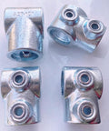 Four 3/4 inch galvanized pipe fittings single socket tee 90-degree connectors for DIY projects like handrails and shelving